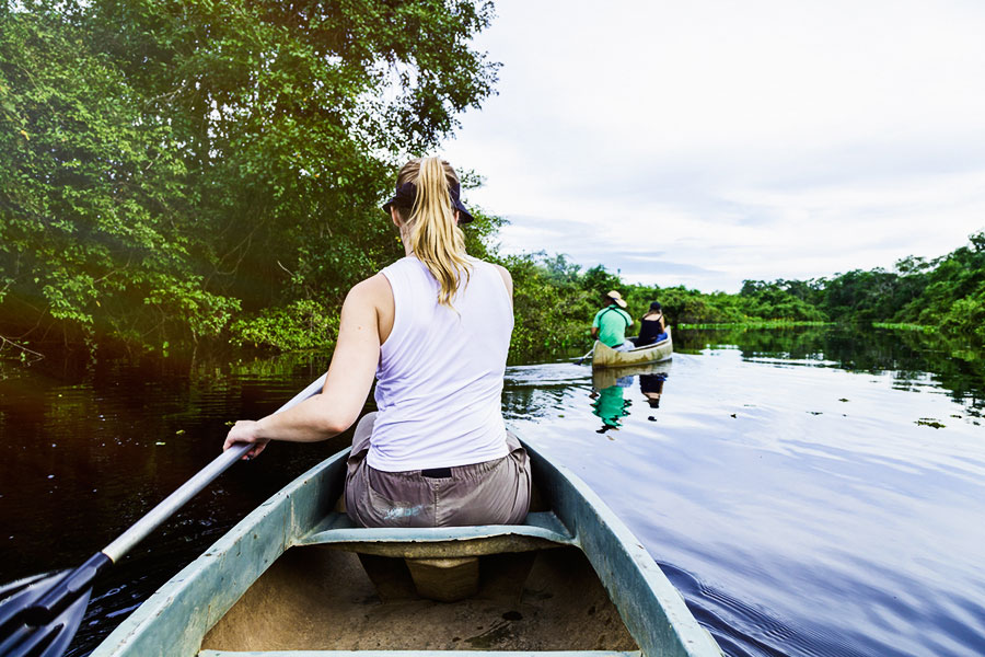 Scanning from the canoe in search of fauna, wild Brazil